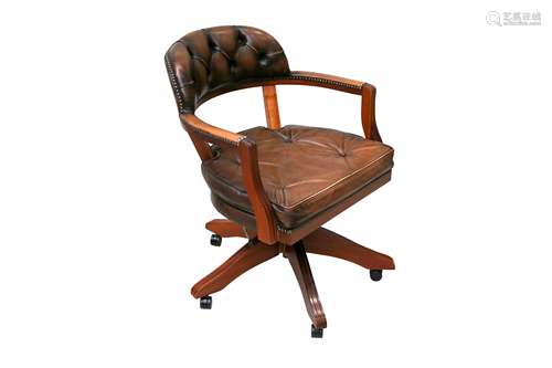 A CONTEMPORARY LEATHER UPHOLSTERED DESK CHAIR