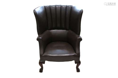 A GEORGE III WINGED AND FANNED BARREL BACK ARMCHAIR