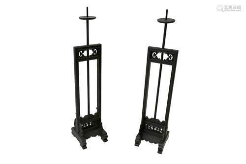 A PAIR OF CHINESE BLACK LACQUERED ADJUSTABLE CANDLE STANDS