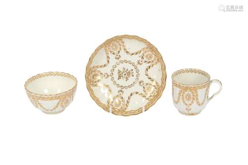 A WORCESTER GILT PORCELAIN COFFEE CUP, TEA BOWL AND SAUCER