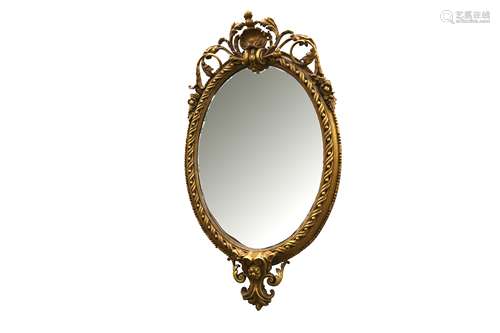 AN OVAL GILTWOOD AND GESSO MIRROR, IN THE FRENCH TASTE, 20TH...