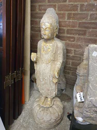 A CHINESE GILT-STONE FIGURE OF A BUDDHA.