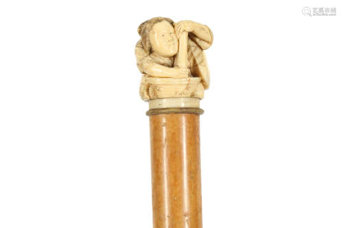 A JAPANESE MEIJI PERIOD CARVED IVORY HANDLED WALKING CANE, E...