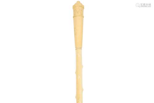 A CARVED MARINE IVORY WALKING CANE, EARLY 20TH CENTURY