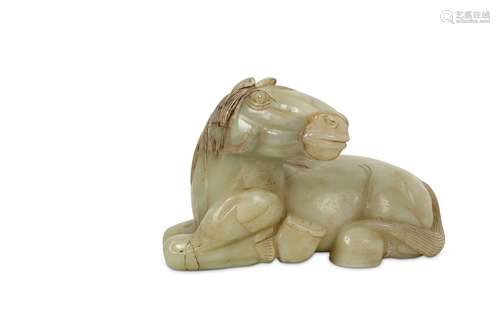 A CHINESE PALE CELADON JADE CARVING OF A RECUMBENT HORSE.