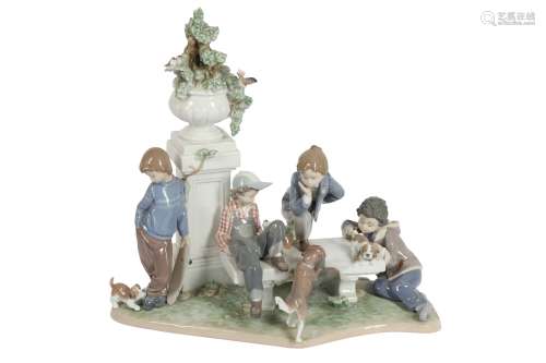 A LLADRO PORELAIN FIGURAL GROUP 'PUPPY DOGS TAILS'