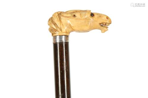 A CARVED MARINE IVORY WALKING CANE, 19TH CENTURY