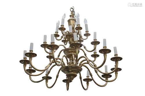 A BRASS TWENTY FOUR LIGHT THREE TIER CHANDELIER