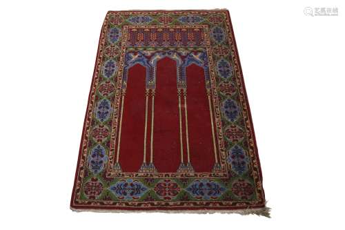 A HEREKE TRIPLE NICHE PRAYER RUG, TURKEY