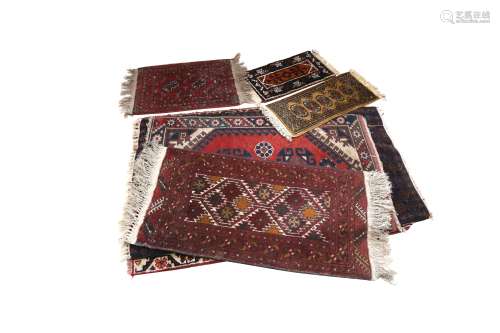 A COLLECTION OF SEVEN RUGS