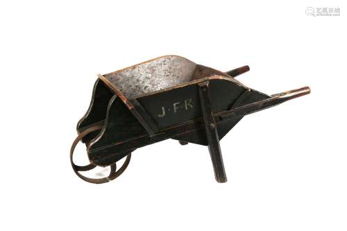 A CHILD'S GREEN PAINTED PINE WHEELBARROW, CIRCA 1880