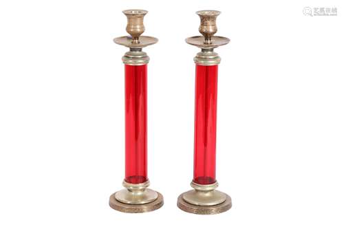 A PAIR OF RED GLASS AND SILVER PLATED CANDLESTICKS, 20TH CEN...