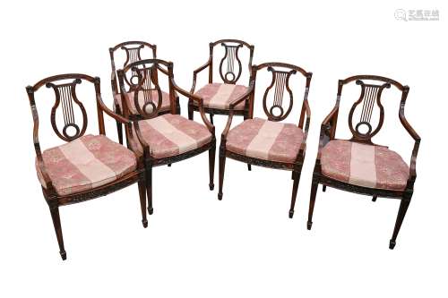 A SET OF SIX NEOCLASSICAL STYLE MAHOGANY LYRE BACK ARMCHAIRS...