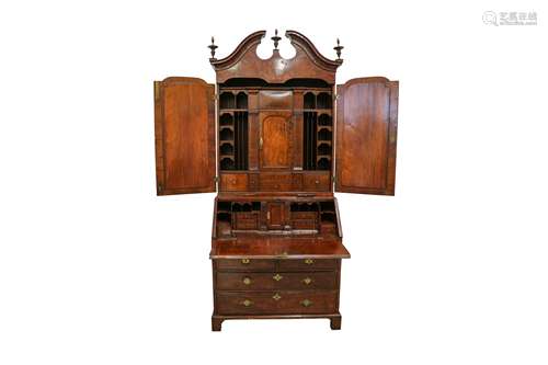 A GEORGE I FIGURED WALNUT CROSS AND FEATHER BANDED BUREAU BO...