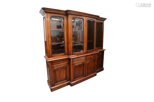 A LARGE MAHOGANY BREAK-FRONTED BOOKCASE, IN THE VICTORIAN ST...