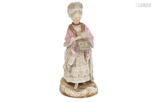 A MEISSEN PORCELAIN FIGURE OF A LADY READING A LETTER WITH A...