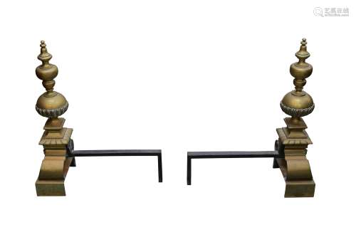 A PAIR OF POLISHED BRASS ANDIRONS IN THE LATE 17TH CENTURY S...