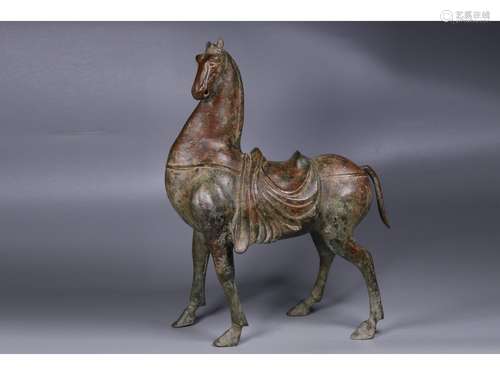 A BRONZE ORNAMENT OF HORSE