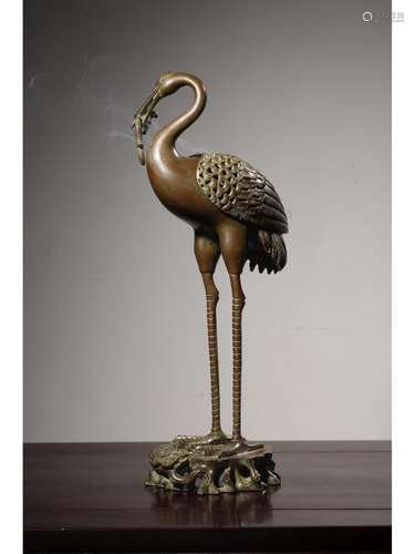 A BRONZE FIGURE OF CRANE