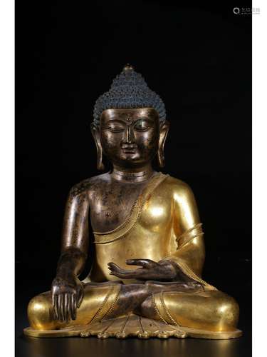 A GILT-BRONZE FIGURE OF SHAKYAMUNI