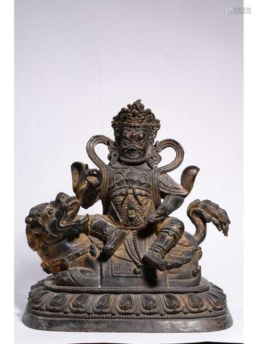 A GILT-BRONZE FIGURE OF JAMBHALA