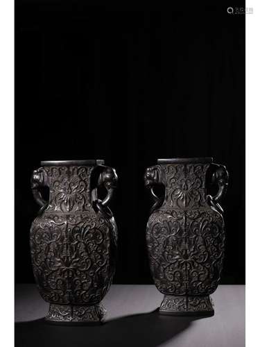 A PAIR OF CARVED VASES