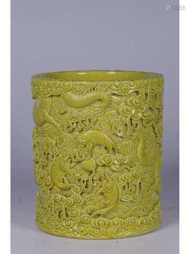 A YELLOW-GLAZED ‘DRAGON’ BRUSH POT