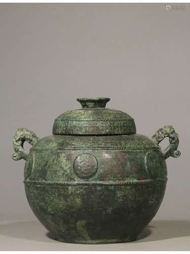 A BRONZE JAR AND COVER