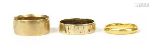 Three gold wedding rings,