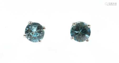 A pair of white gold blue zircon stud earrings,