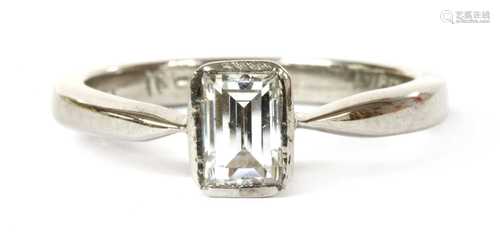 A white gold single stone emerald cut diamond ring,