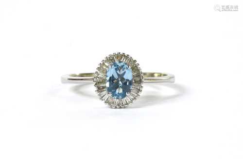 A white gold aquamarine and diamond cluster ring,