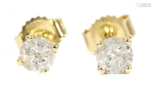 A pair of gold single stone diamond stud earrings,