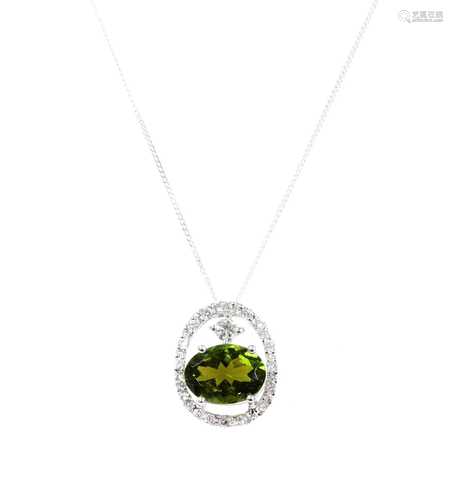 A gold green tourmaline and diamond pendant,