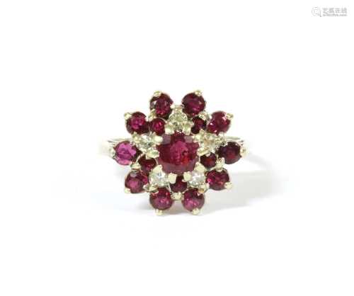 A 9ct white gold ruby and diamond cluster ring,