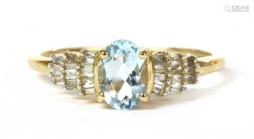 A gold aquamarine and diamond ring,