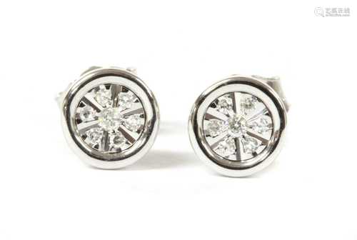 A pair of white gold diamond earrings,