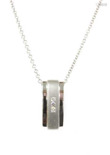 An 18ct white gold diamond pendant,