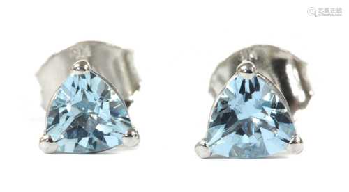 A pair of white gold single stone aquamarine stud earrings,