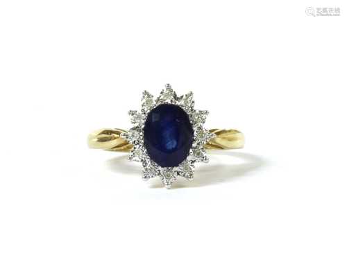 A gold sapphire and diamond cluster ring,