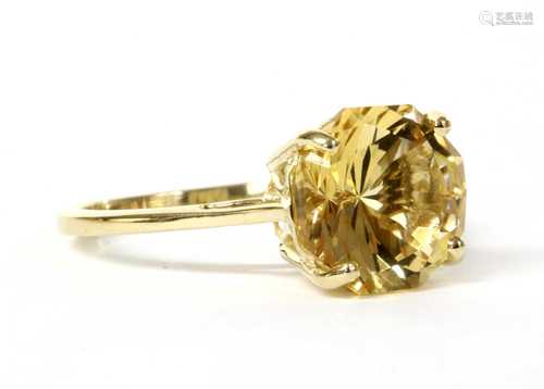 A gold single stone citrine ring,