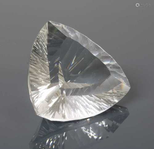 An unmounted triangular laser cut rock crystal quartz,