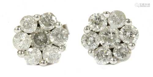 A pair of white gold diamond daisy cluster earrings,