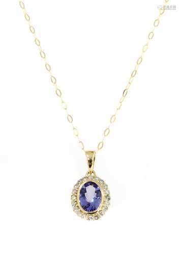 A gold tanzanite and diamond cluster pendant,