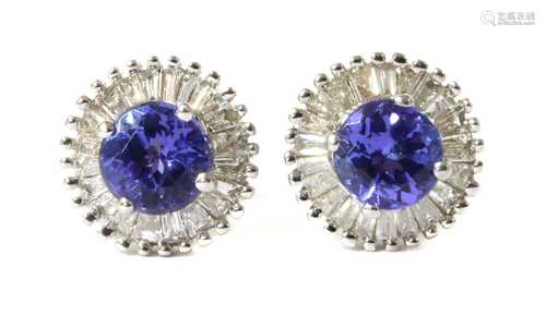 A pair of white gold tanzanite and diamond cluster stud earr...