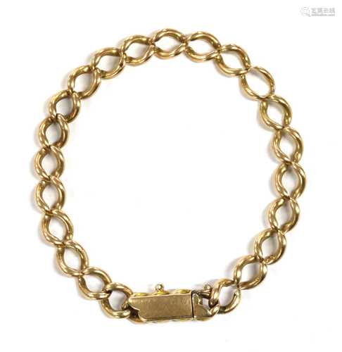 A gold curb bracelet,