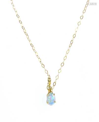 A gold synthetic opal and diamond pendant,