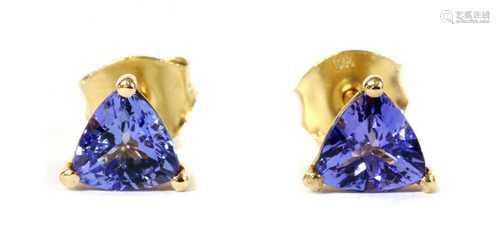 A pair of gold single stone tanzanite stud earrings,