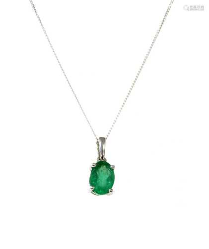 A white gold single stone emerald pendant,