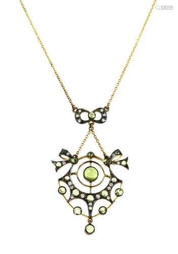 A silver and gold, peridot and diamond pendant,